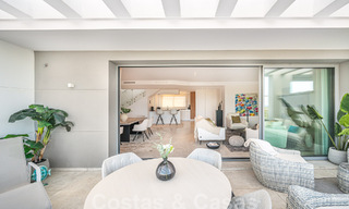 Move-in ready! Modern, luxurious penthouse for sale bordering the golf course, with sea and golf views, East Marbella 62302 